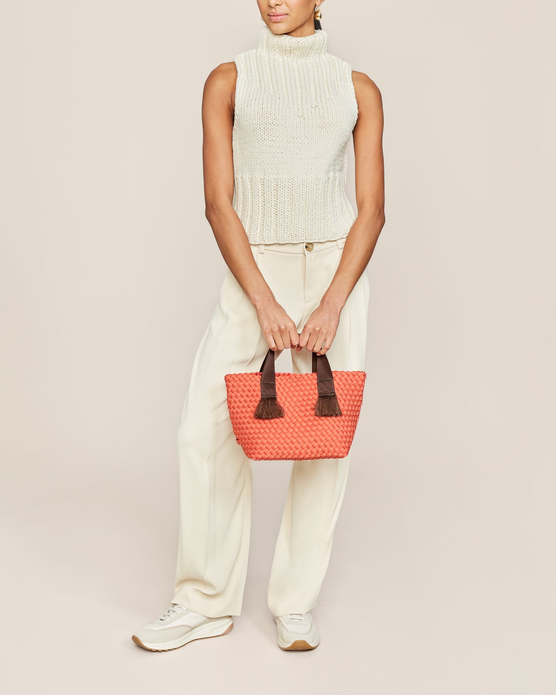 A woven texture crossbody bag with a structured flap and slender strap—evoking coastal charm with tactile appeal and refined artistry-5