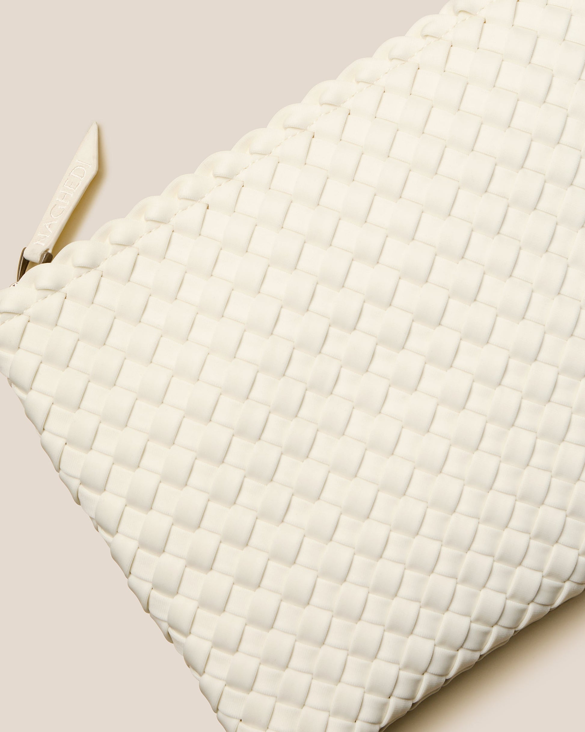 A beautifully crafted Jasmine crossbody bag featuring woven textures, compact flap closure, and elegant tassel details—embodying artisanal design and refined style-2