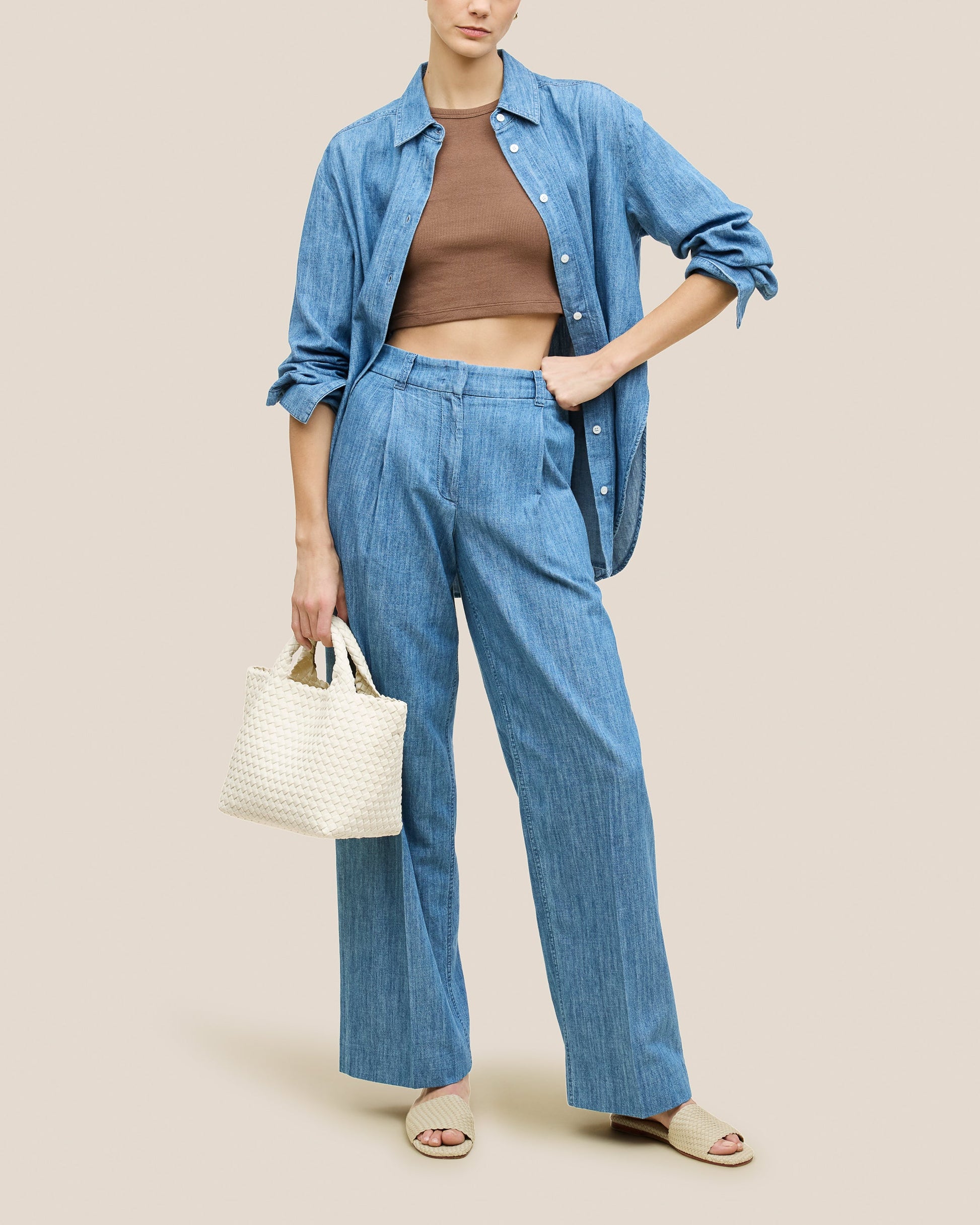 A beautifully crafted Jasmine crossbody bag featuring woven textures, compact flap closure, and elegant tassel details—embodying artisanal design and refined style-5