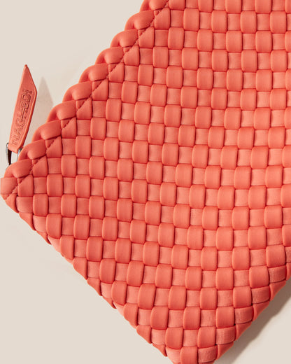 A woven texture crossbody bag with a structured flap and slender strap—evoking coastal charm with tactile appeal and refined artistry-2
