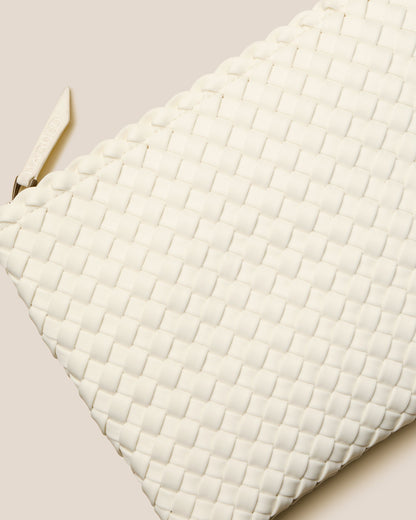 A beautifully crafted Jasmine crossbody bag featuring woven textures, compact flap closure, and elegant tassel details—embodying artisanal design and refined style-2