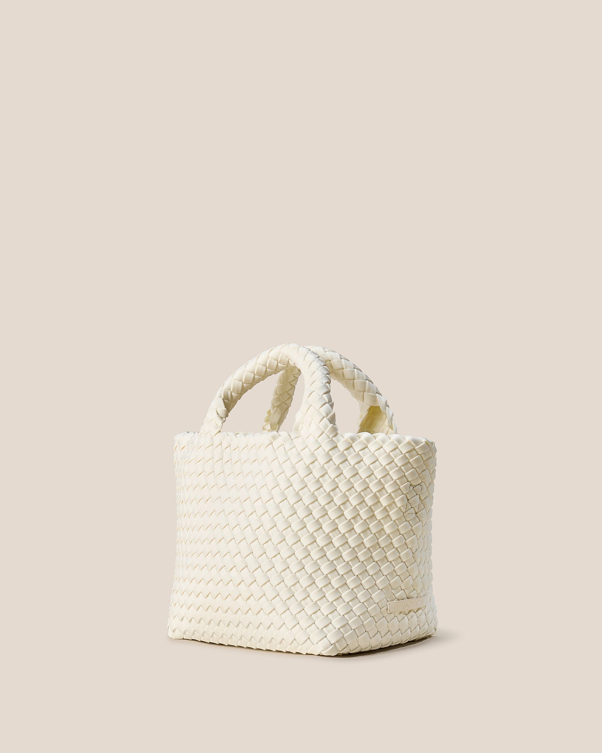 A beautifully crafted Jasmine crossbody bag featuring woven textures, compact flap closure, and elegant tassel details—embodying artisanal design and refined style-3
